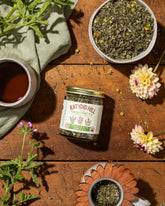 garden mint tea on wood background with cup of tea