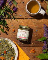 flower tea on wood background with cup of tea