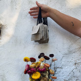 hand holding linen tea bags