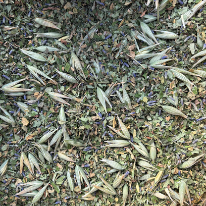 Close-up of loose leaf herbal tea with lavender, milky oats, rose geranium and lemon balm leaves