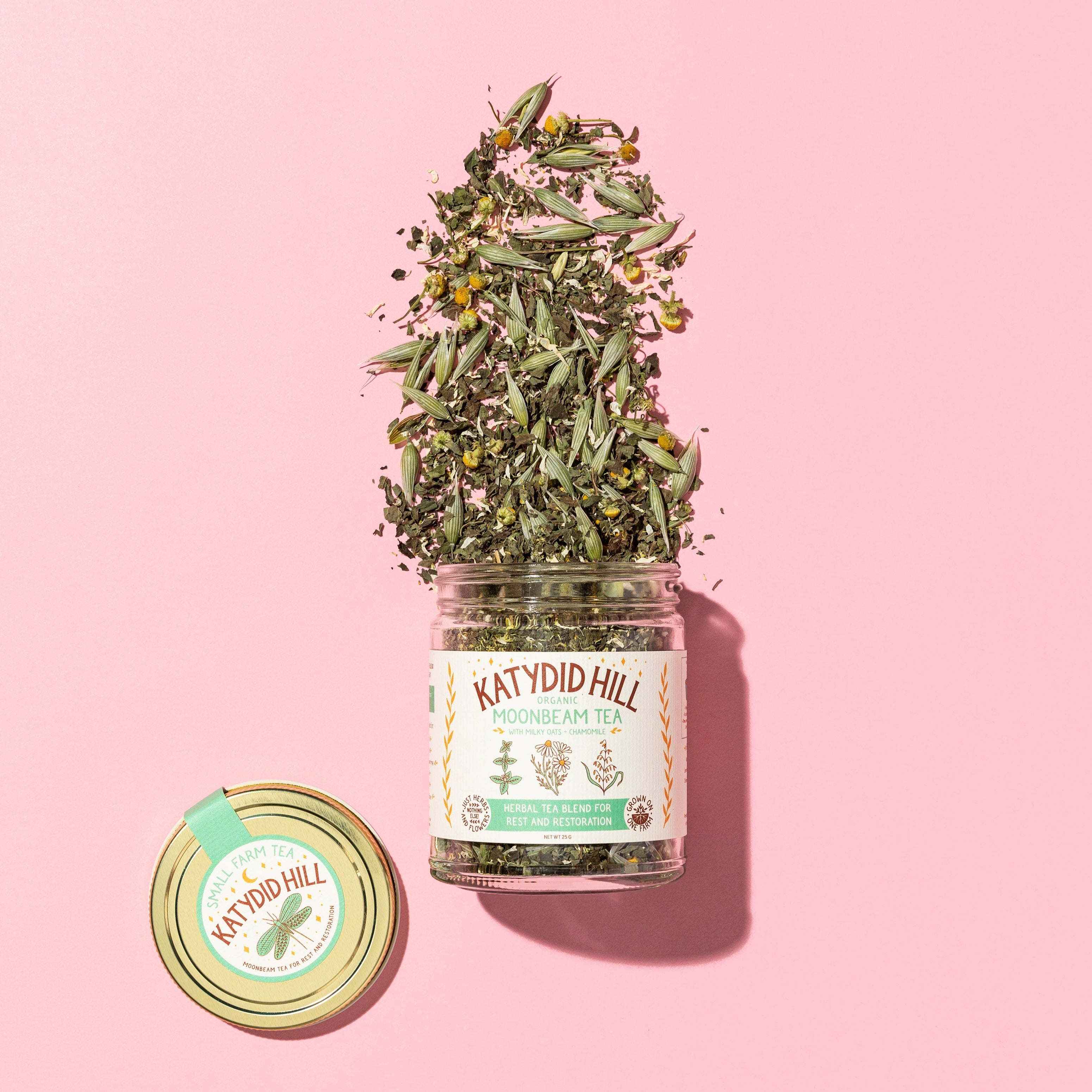 glass jar of moonbeam loose leaf tea on to pink background.