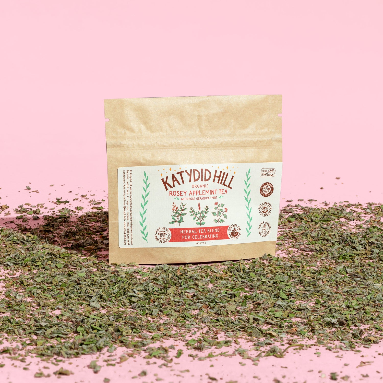 rosey applemint tea sample pack with loose herbs and pink background