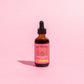 closed bottle of tenderhearted elixir on pink background